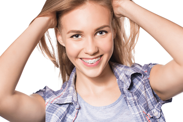 Girl with braces on her teeth after knowing the cost of braces.